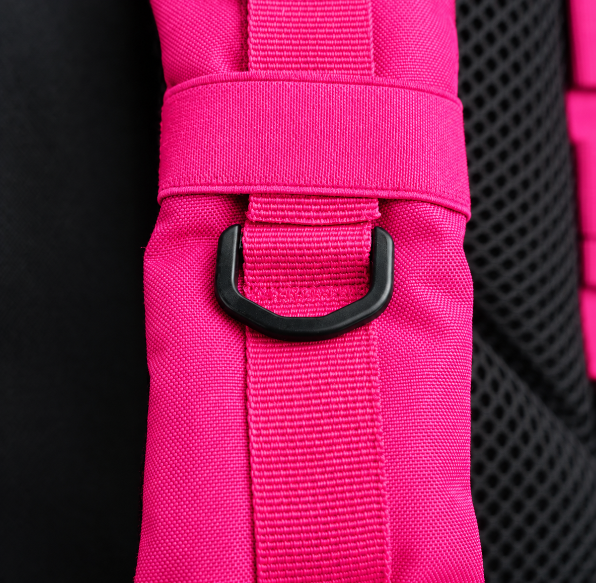 hot pink backpack – shoulder strap with black fitting detail