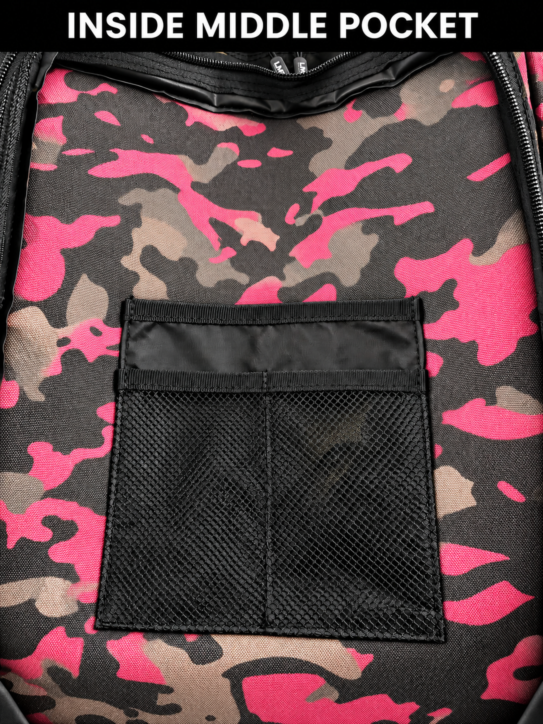 Inside middle pocket of pink camo backpack