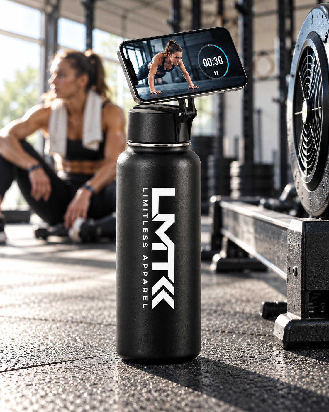 LMT bottle MagSafe phone mount beside gym equipment