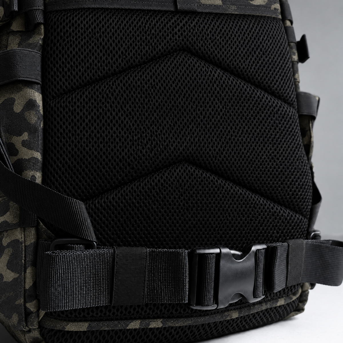 black camo backpack – rear waist strap and black mesh detail