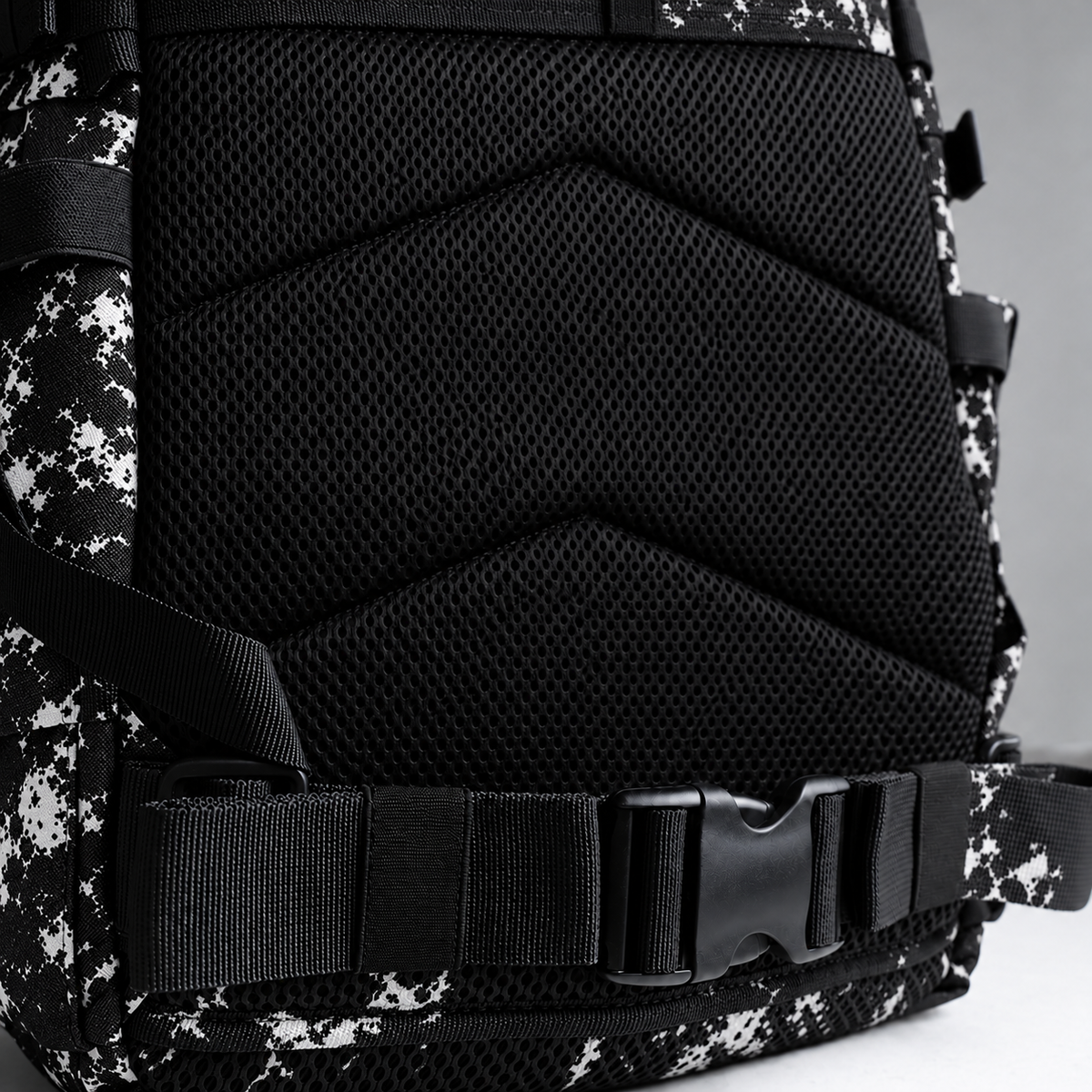 black white tie dye backpack – rear waist strap and black mesh detail