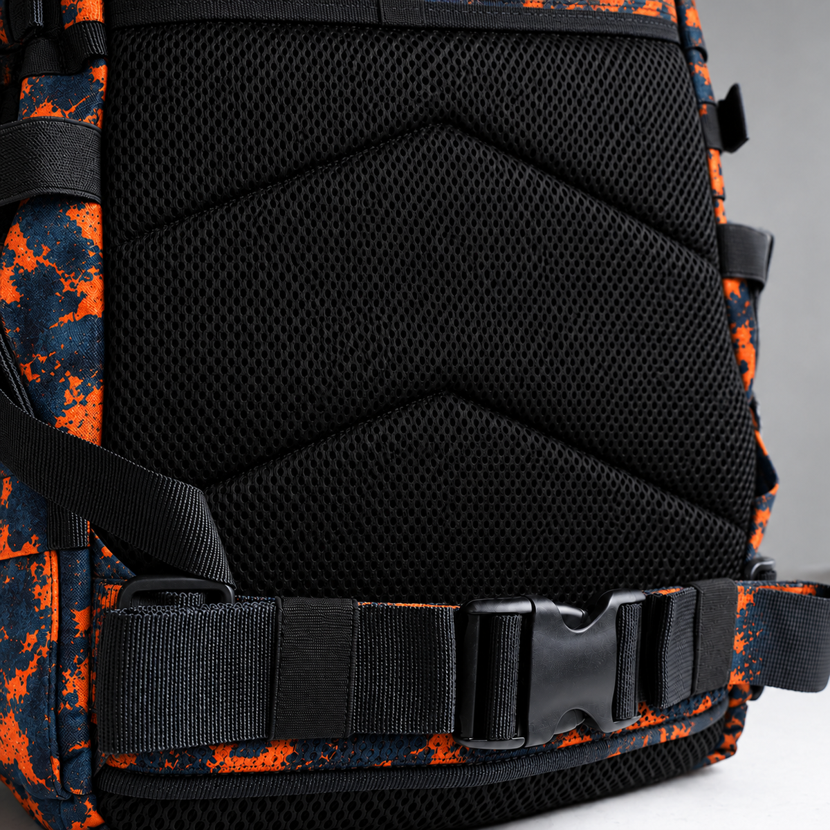 blue orange tie dye backpack – rear waist strap and black mesh detail