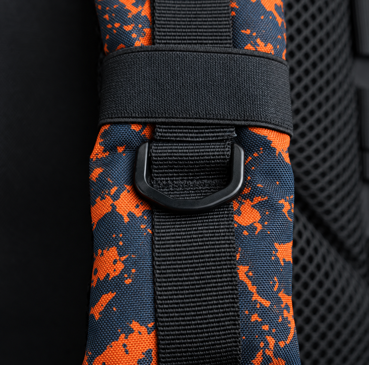 blue orange tie dye backpack – shoulder strap with black fitting detail