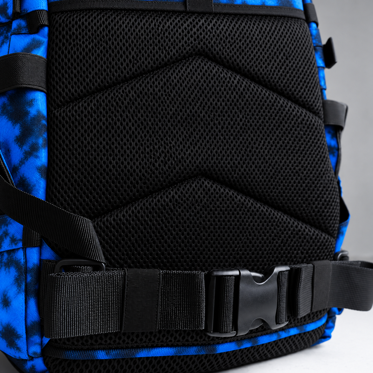 blue tie dye backpack – rear waist strap and black mesh detail