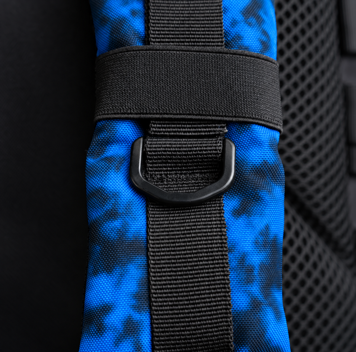 blue tie dye backpack – shoulder strap with black fitting detail