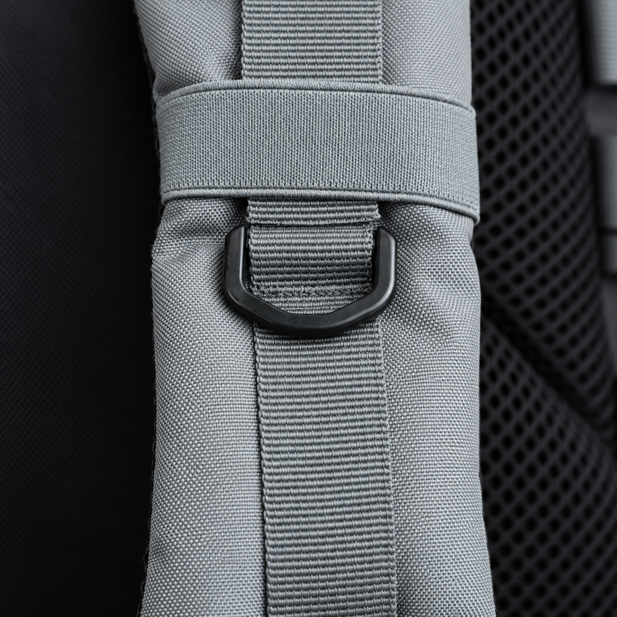 grey backpack – shoulder strap with black fitting detail