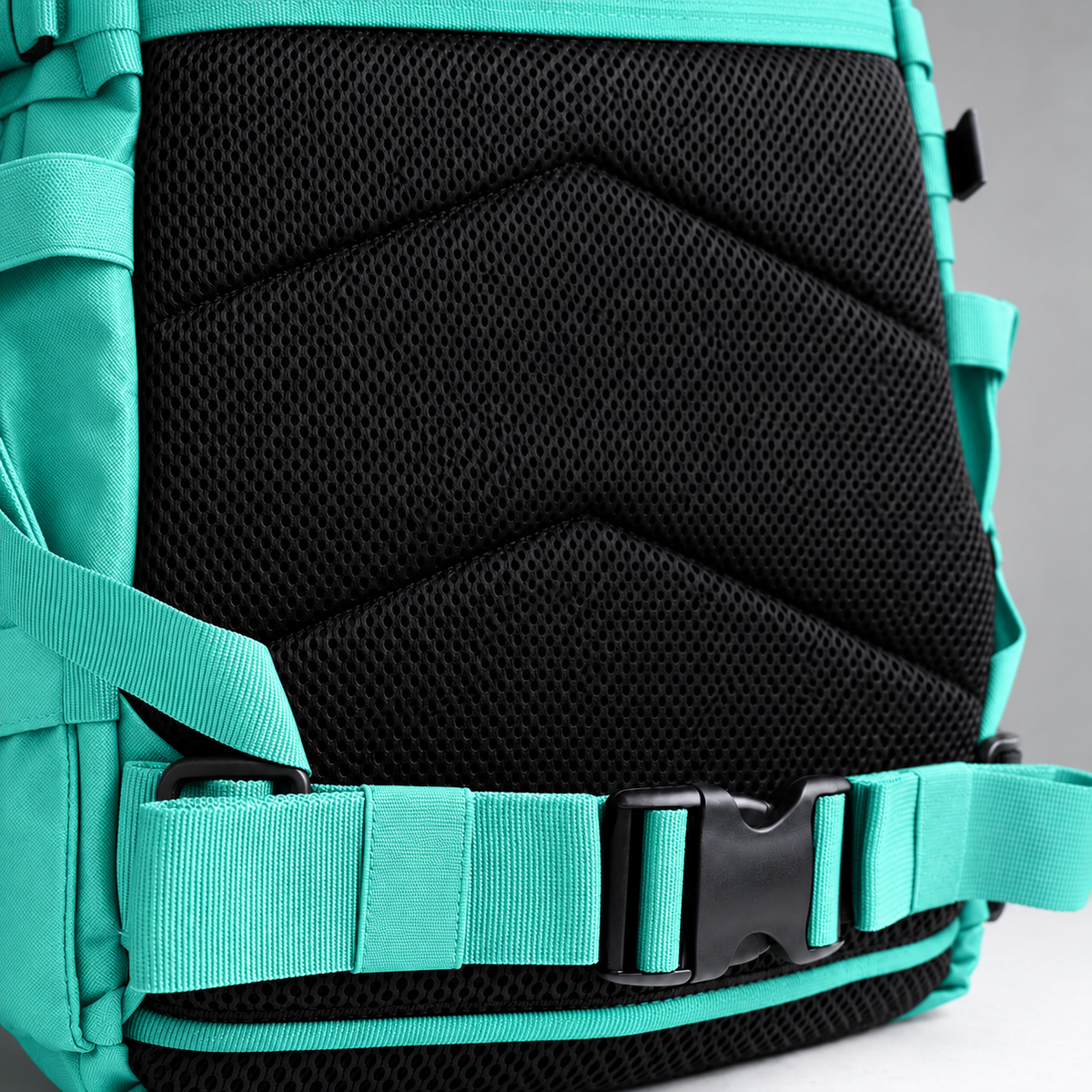 mint backpack – rear waist strap and black mesh detail