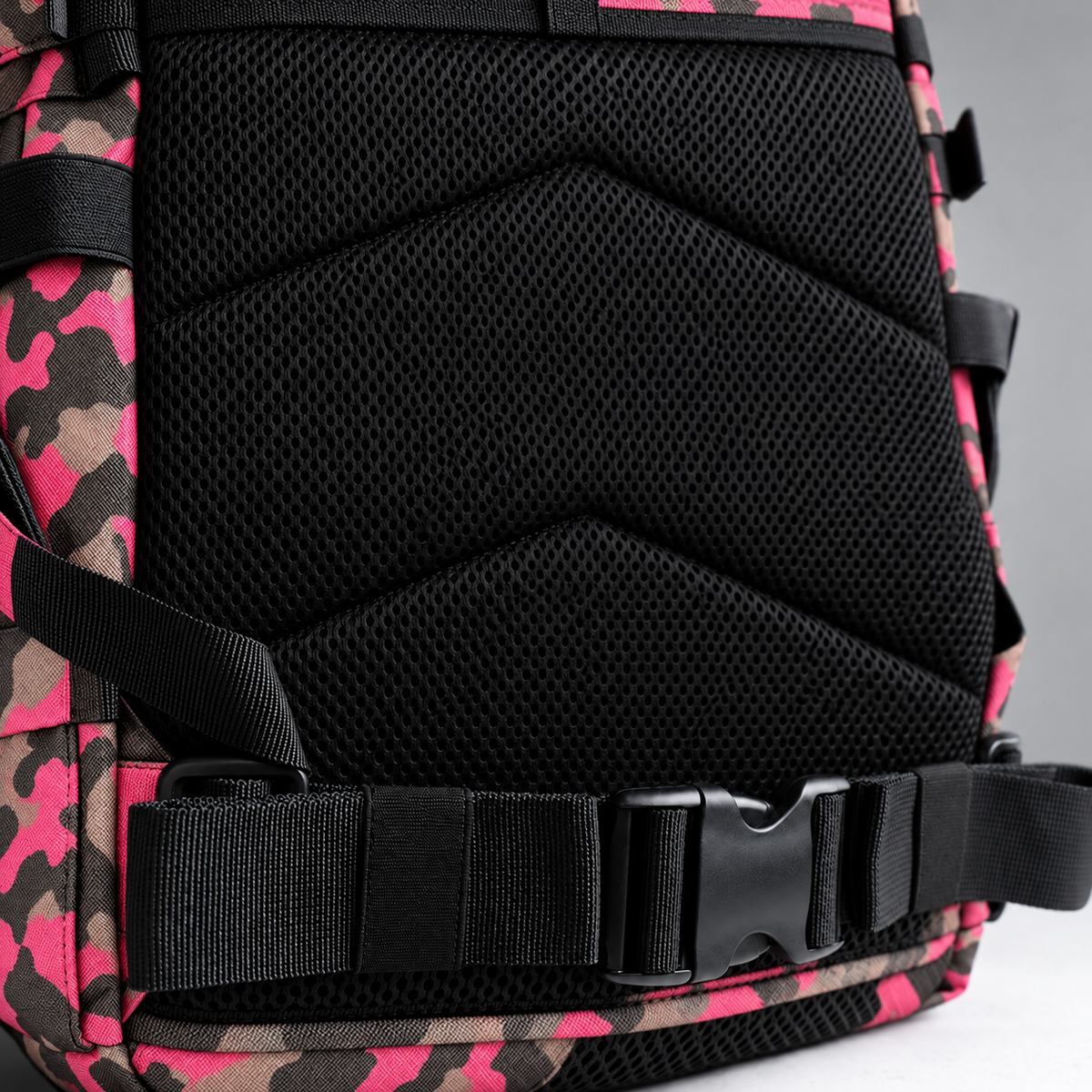 pink camo backpack – rear waist strap and black mesh detail