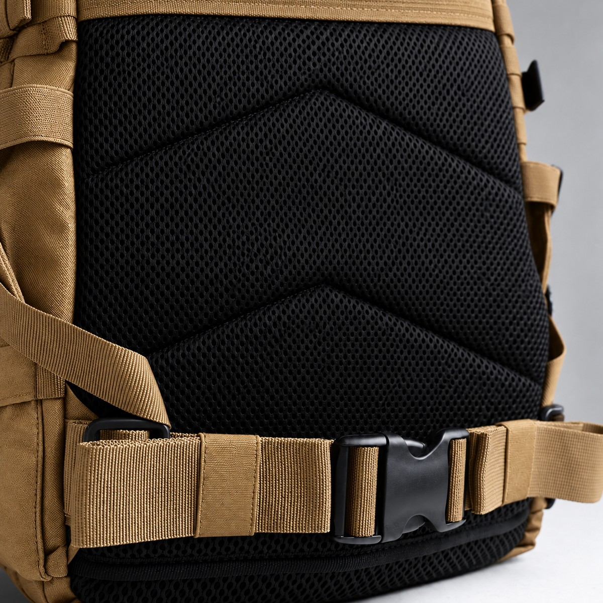 tan backpack – rear waist strap and black mesh detail