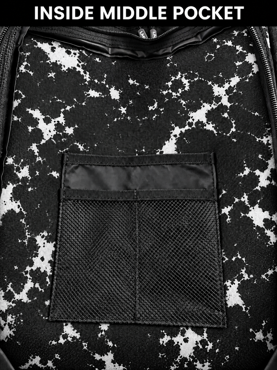 Inside middle pocket of black white tie dye backpack