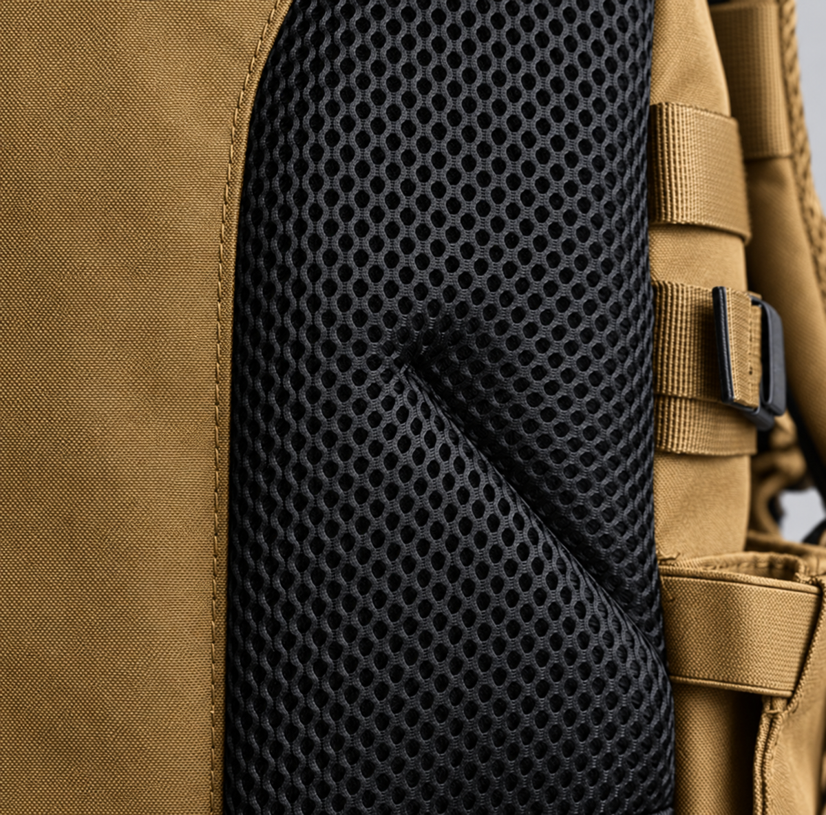 tan backpack – black breathable mesh detail