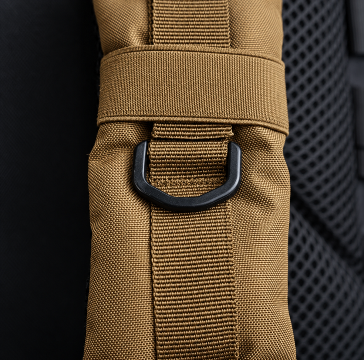tan backpack – shoulder strap and black D-ring