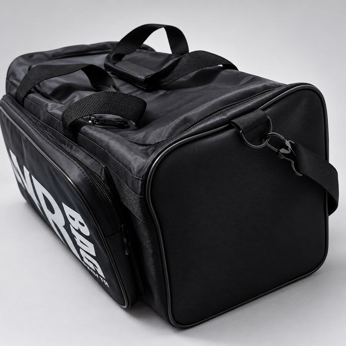 Angled view showing end panel and shoulder strap
