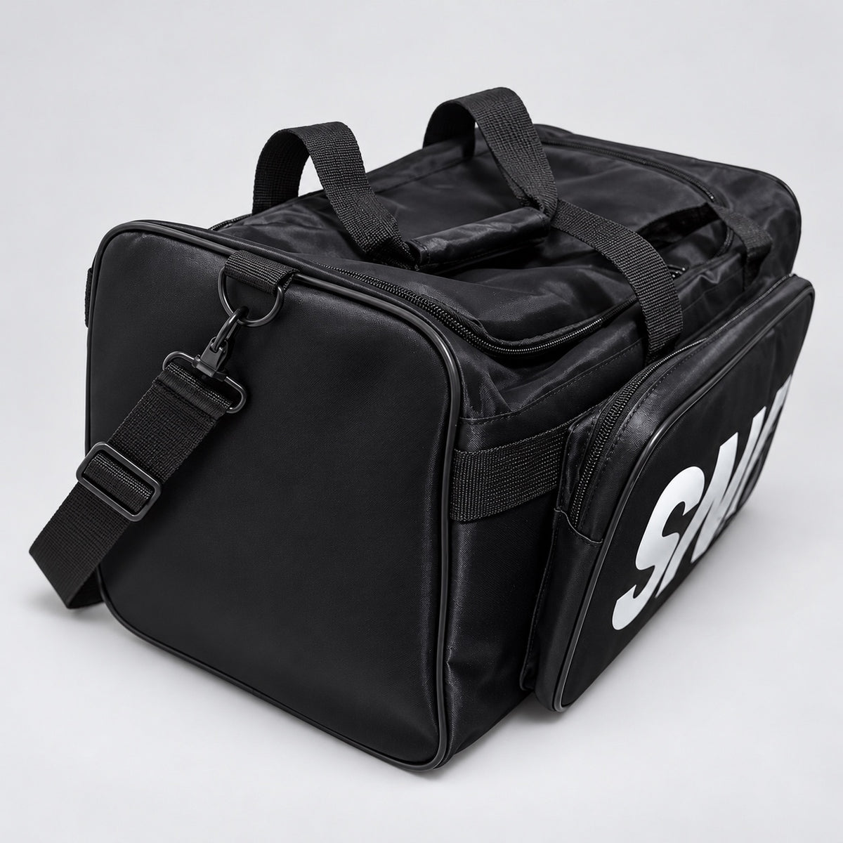 Angled view of side compartment and detachable strap